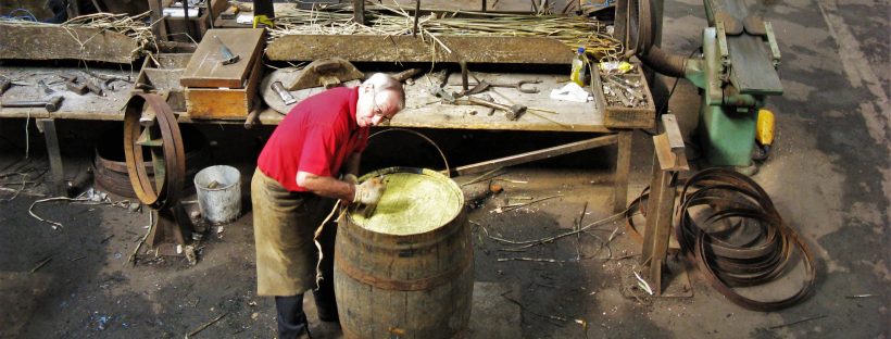A cooper practising his craft at the Speyside Cooperage